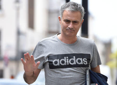 Jose Mourinho gestures as he walks towards his house in London, Britain, May 27, 2016. REUTERS/Toby Melville