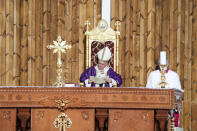 Pope Francis celebrates mass at the Franso Hariri Stadium in Irbil, Kurdistan Region of Iraq, Sunday, March 7, 2021. The Vatican and the pope have frequently insisted on the need to preserve Iraq's ancient Christian communities and create the security, economic and social conditions for those who have left to return.(AP Photo/Andrew Medichini)