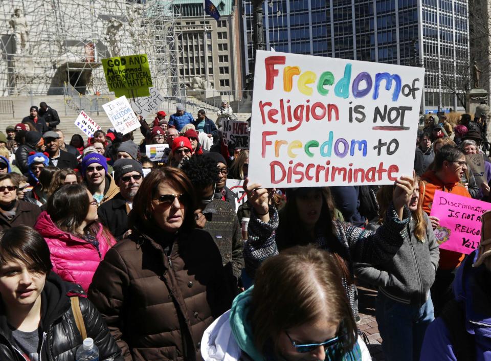 Demonstrators gather to protest a controversial religious freedom bill in Indianapolis