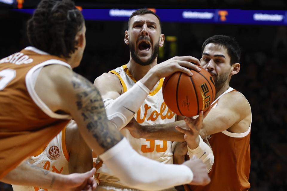 Tennessee forward Uros Plavsic grabs a rebound. Inside play was one of the keys to the Longhorns' loss; they were outrebounded 38-24.
