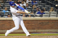 New York Mets pinch-hitter Brandon Drury hits a solo home run during the seventh inning of the team's baseball game against the Atlanta Braves, Wednesday, July 28, 2021, in New York. (AP Photo/Mary Altaffer)