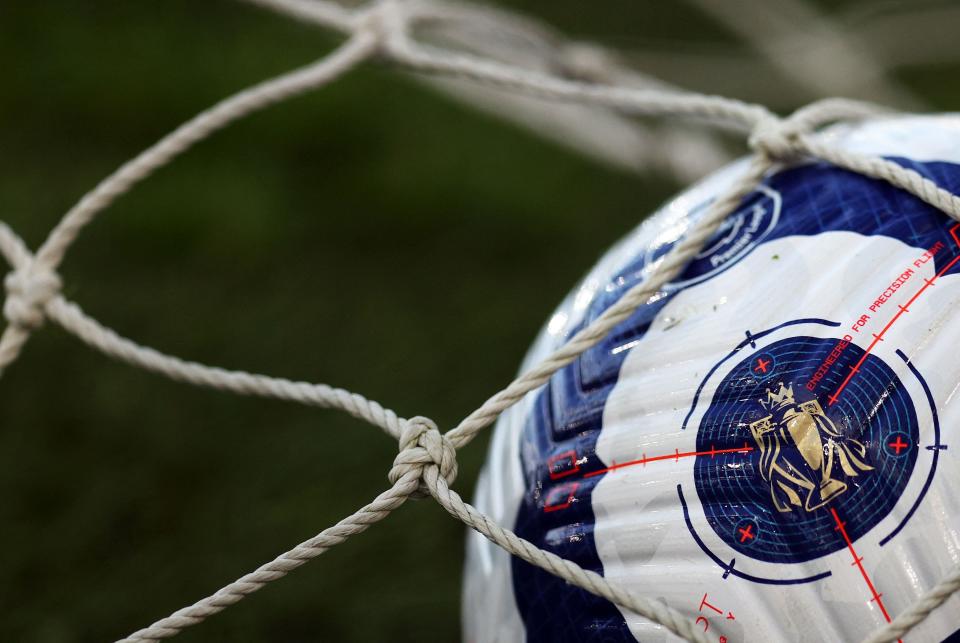 A Premier League trophy logo is seen on a matchball