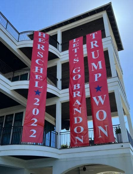 These banners, hanging from the home of Georgia businessman Marvin Peavy beside Walton County Road 30A, are at the center of a case making its way through Walton County Circuit Court.