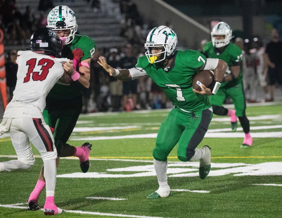 Fort Myers quarterback Chris McFoley runs in a touchdown against South Fort Myers on Friday, Oct. 13, 2023, at Fort Myers High School.