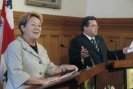 Parti Quebecois leader Pauline Marois speaks to the media with Montreal mayor Denis Coderre in Montreal, Quebec, March 16, 2014. Quebec voters will go to the polls in a provincial election April 7. REUTERS/Christinne Muschi (CANADA - Tags: POLITICS ELECTIONS)