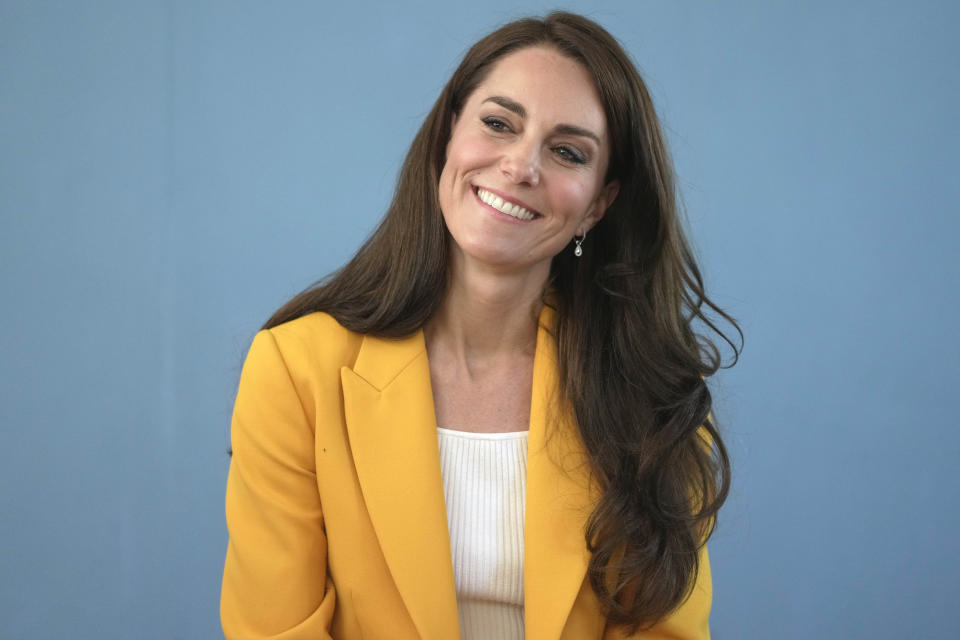 FILE - Britain's Kate, Princess of Wales, smiles as she visits the Dame Kelly Holmes Trust and meets with some of the young people that the charity supports, May 16, 2023, in Bath, England. The scandal over Kate, Princess of Wales’ family snapshot — dubbed “photogate” — is a new chapter in the thorny relationship between the media and Britain’s royal family. (AP Photo/Kin Cheung, Pool, File)