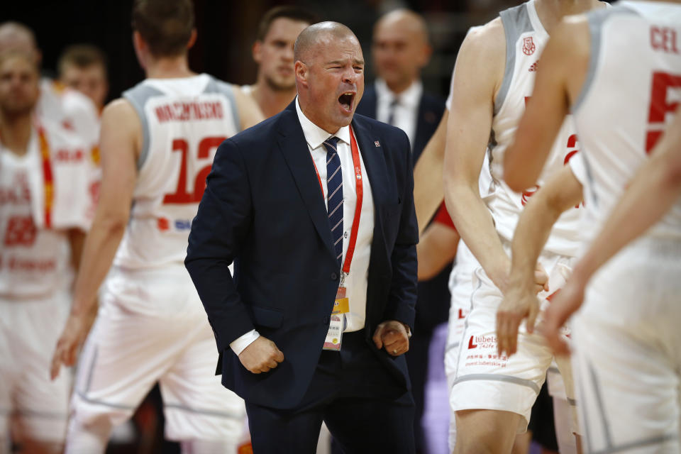 In this Saturday, Aug. 31, 2019 photo, Poland's head coach Mike Taylor celebrates during their group phase basketball game against Venezuela in the FIBA Basketball World Cup at the Cadillac Arena in Beijing. American coach Mike Taylor led Poland to its first World Cup victory in 52 years in the first game against Venezuela. Now he'll try to upset host China in the second game on Monday. (AP Photo/Mark Schiefelbein)