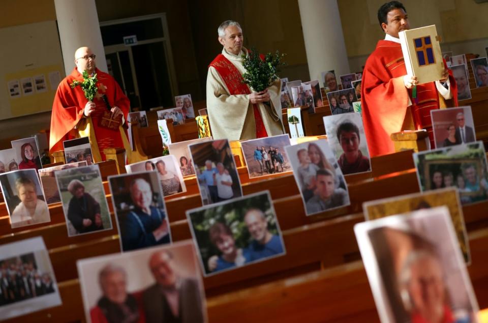 <div class="inline-image__caption"><p>Priest Joachim Giesler held a mass with photos of believers who were asked to send in pictures after the service was closed due to the spread of coronavirus disease (COVID-19) in Achern, Germany, April 5, 2020.</p></div> <div class="inline-image__credit">Kai Pfaffenbach/Reuters</div>