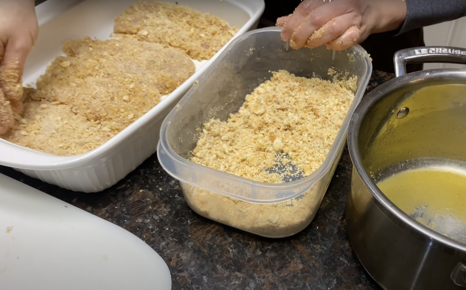 Raw chicken and crushed Ritz crackers for dredging.