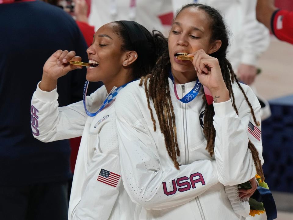 Brittney Griner and A'ja Wilson celebrate winning gold at the Tokyo Olympics.