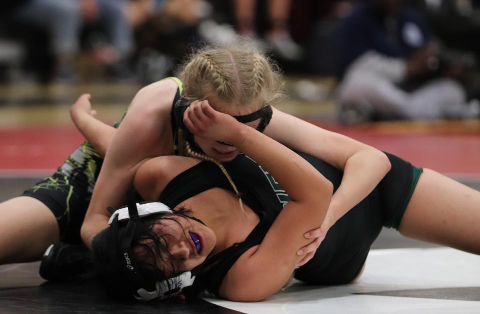 Lily Jade Sinclair (top) of Ventura is in control of her match during the Channel League wrestling finals on Saturday at Rio Mesa High. Sinclair won the  108-pound title and earned Lower Weight MVP honors.