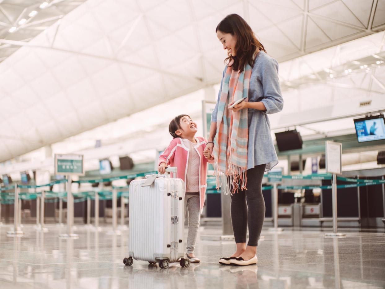 mom and daughter at airport