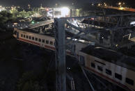 This photo released by Military News Agency shows a general view at the site of a train derailment in Lian in northern Taiwan on Sunday, Oct. 21 2018. The Puyuma express train was carrying more than 300 passengers toward Taitung, a city on Taiwan's southeast coast, when it went off the tracks on Sunday afternoon. (Taiwan Railways Administration via AP)