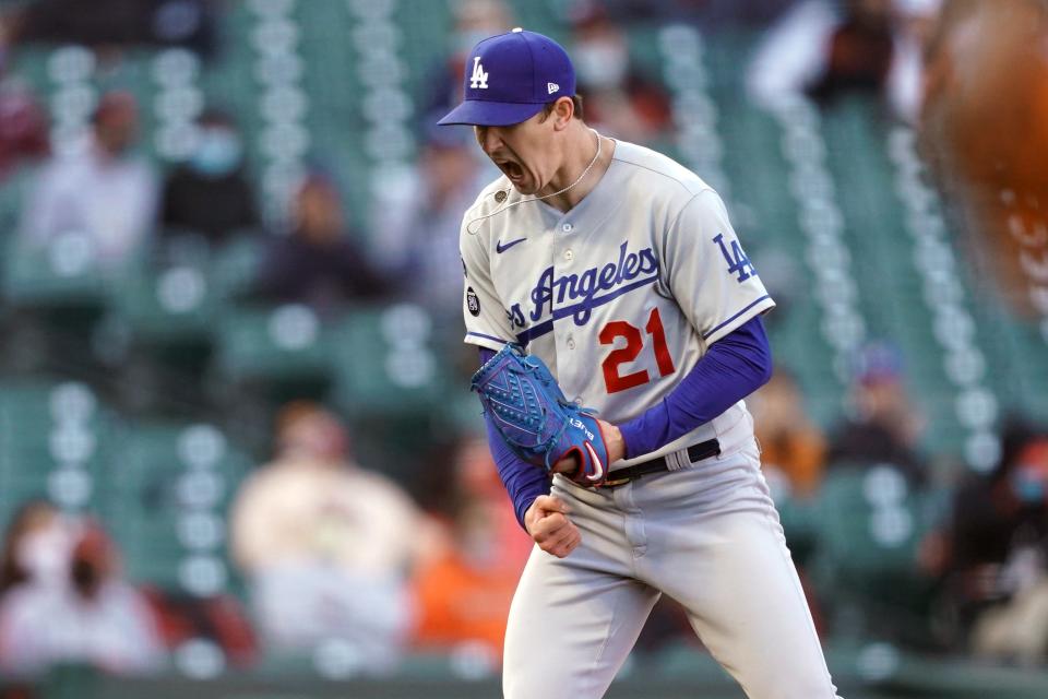 Walker Buehler reacts after a strikeout against the Giants in May.