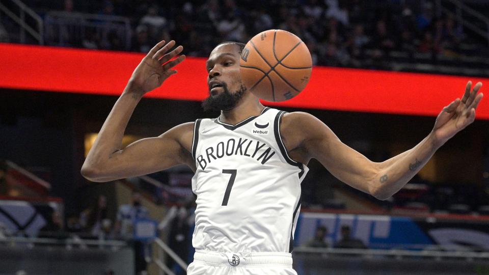 Brooklyn Nets forward Kevin Durant (7) dunks the ball during the first half of an NBA basketball game against the Orlando Magic, Wednesday, Nov. 10, 2021, in Orlando, Fla.
