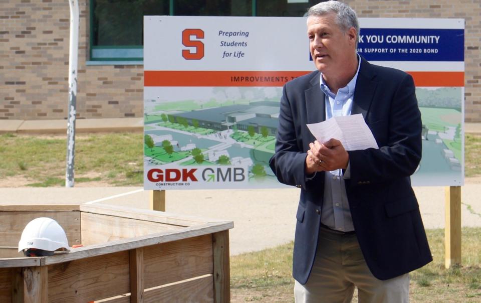 Saugatuck Public Schools Superintendent Tim Travis speaks during a groundbreaking ceremony at Douglas Elementary School in May 2021.