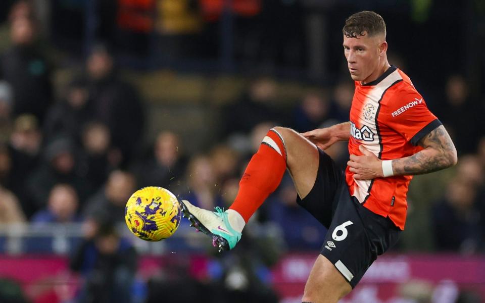 Luton Town's Ross Barkley kicks the ball during the English Premier League soccer match between Luton and Arsenal at Kenilworth Road, Luton, England, Saturday, Dec 5