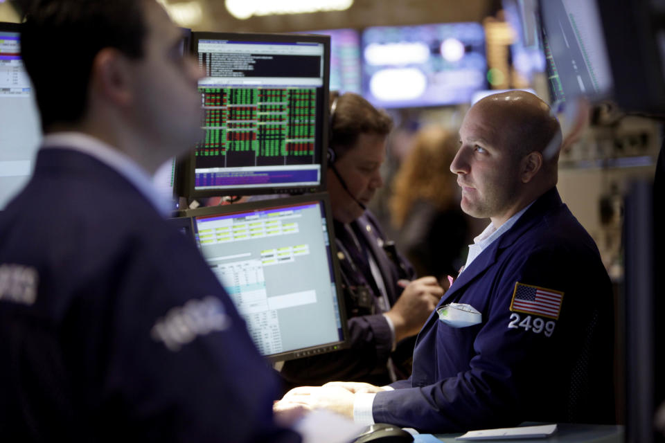 Traders work on the floor of the New York Stock Exchange, Thursday, Nov. 15, 2012. Stock indexes are inching higher in early trading Thursday after U.S. retail giants Wal-Mart and Target turned in mixed earnings reports.(AP Photo/Seth Wenig)