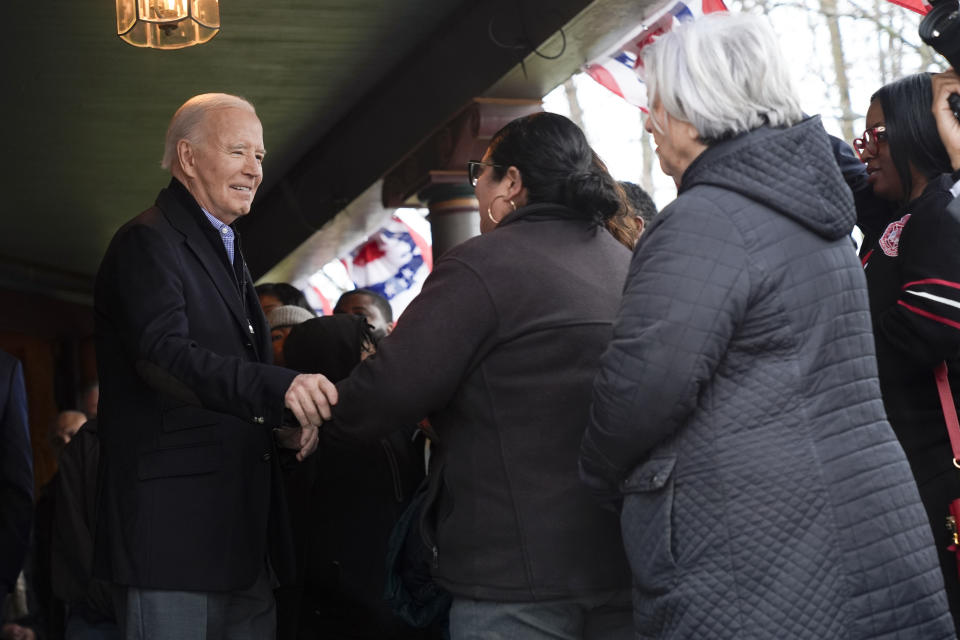 President Joe Biden, left, talks with supporters during a campaign event in Saginaw, Mich., Thursday, March 14, 2024. (AP Photo/Jacquelyn Martin)