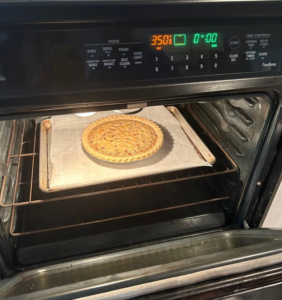 Ina Garten's Bourbon Chocolate Pecan Pie in the oven