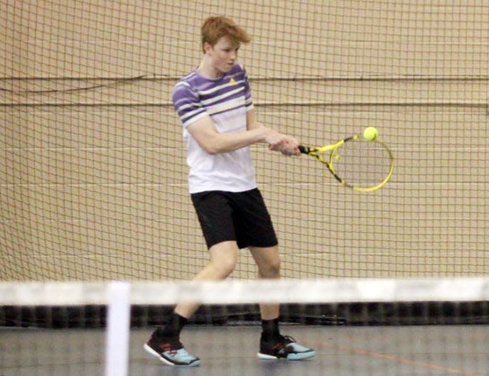 Watertown's Curtis Sneden hits a backhand return during a high school tennis dual against Huron on Thursday, April 6, 2023, at the Nordby Center for Recreation in Huron.