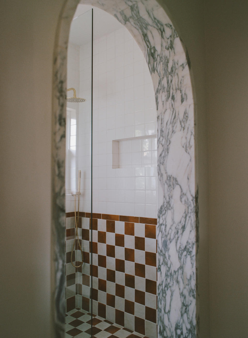 A curved archway in marble