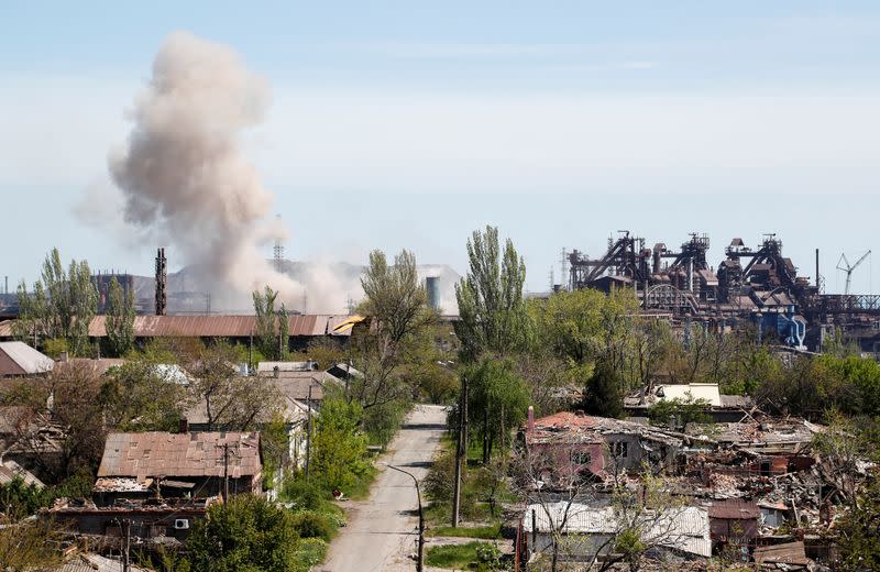 Smoke rises above a plant of Azovstal Iron and Steel Works in Mariupol