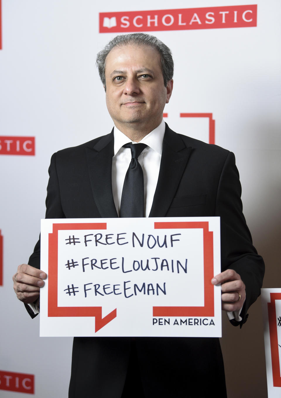 Former United States Attorney for the Southern District of New York and author Preet Bharara poses holding a sign in support of jailed Saudi women's rights activists Nouf Abdulaziz, Loujain Al-Hathloul and Eman Al-Nafjan at the 2019 PEN America Literary Gala at the American Museum of Natural History on Tuesday, May 21, 2019, in New York. (Photo by Evan Agostini/Invision/AP)
