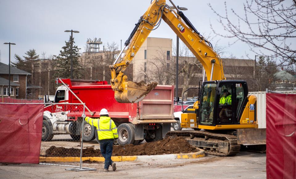 Construction crews work on the final phase of the Clear Creek culvert reconstruction, happening from Dunn Street to Indiana Avenue, on Wednesday, Feb. 7, 2024.