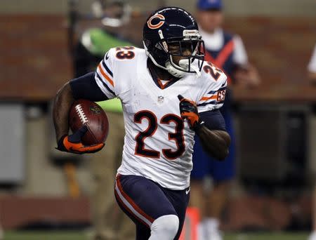 FILE PHOTO: Devin Hester carries the ball against the Detroit Lions during the first half of their NFL football game in Detroit, Michigan December 30, 2012. REUTERS/Rebecca Cook