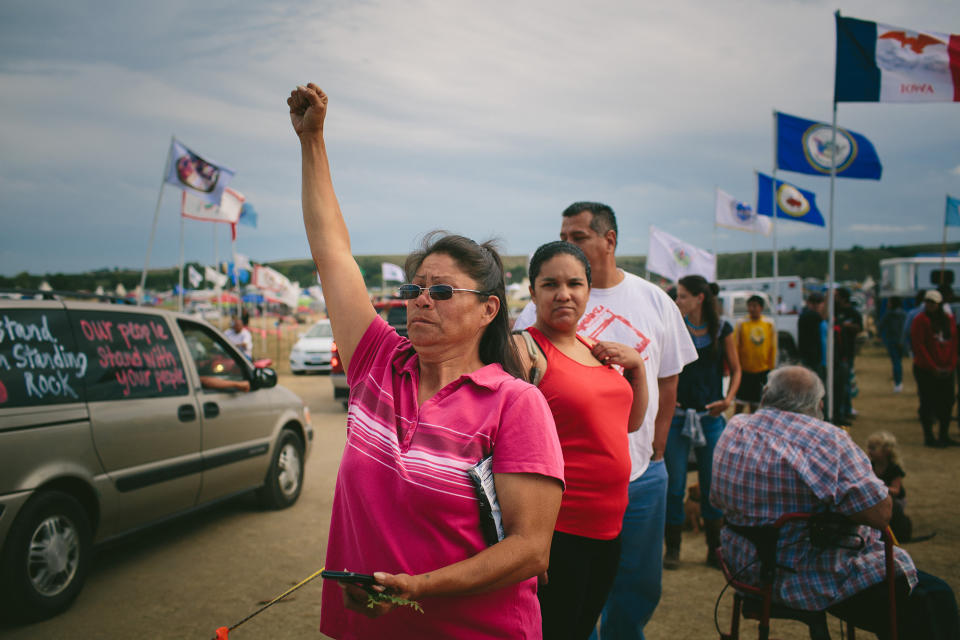 <p>Yvette Gray of Standing Rock cheers as more protesters arrive at the camp near the Standing Rock reservation near Bismarck, N. D., on Sept. 6, 2016. “I’m here to fight for our water and our rights and for our people and my grandchildren,” Gray said. (Photo: Alyssa Schukar for Yahoo News) </p>