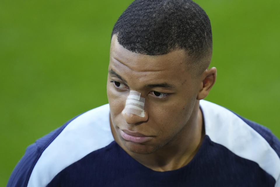 France's Kylian Mbappe gestures as he leaves the field after a training session in Paderborn, Germany, Wednesday, June 19, 2024. France will play against Netherland during their Group D soccer match at the Euro 2024 soccer tournament on June 21. (AP Photo/Hassan Ammar)