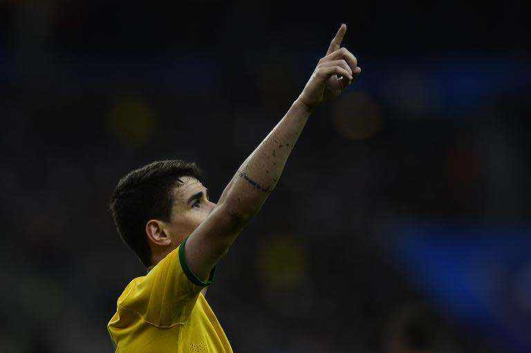 Brazil's forward Oscar celebrates after scoring a goal during the friendly football match France vs Brazil, on March 26, 2015 at the Stade de France in Saint-Denis, north of Paris