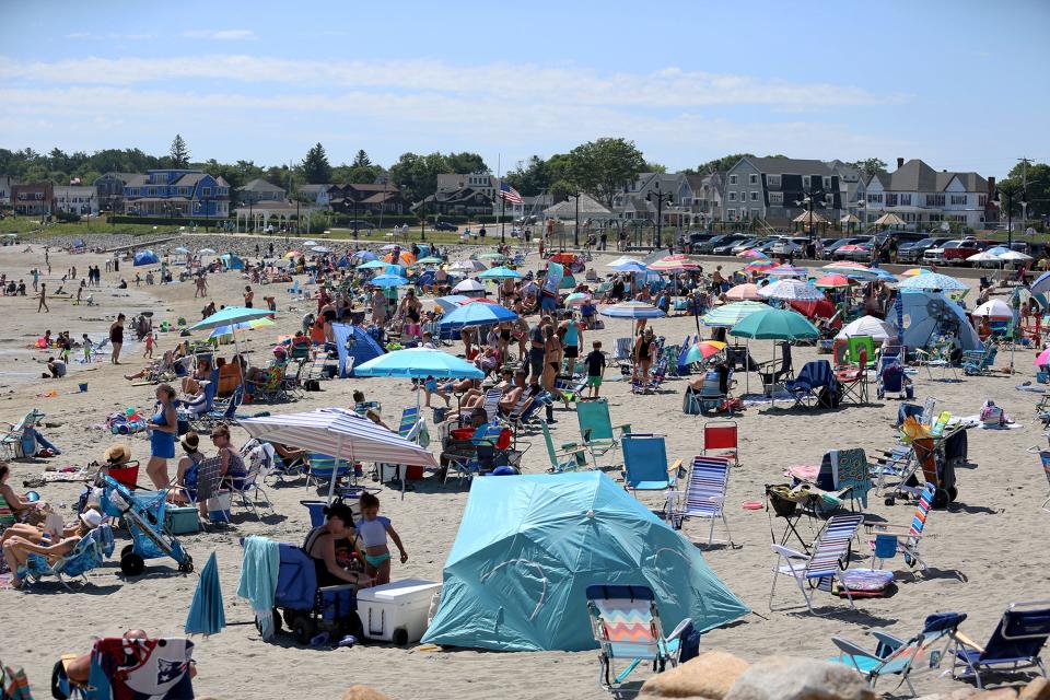 Beachgoers flock to Short Sands Beach on Thursday, July 7, 2022.