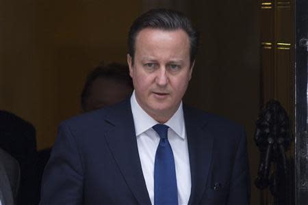 Britain's Prime Minister David Cameron leaves Number 10 Downing Street to attend Prime Minister's Questions at parliament in London February 12, 2014. REUTERS/Neil Hall