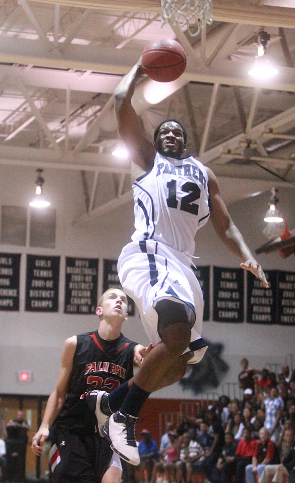 Dwyer's Jacoby Brissett goes in for dunk against Melbourne-Palm Bay during boys prep regional final basketball game at Dwyer in 2011.