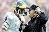 FILE - Michigan head coach Bo Schembechler yells at quarterback Jim Harbaugh during the Rose Bowl NCAA college football game in Pasadena, Calif., on Jan. 2, 1987. Harbaugh has been the most scrutinized coach in college football for seven seasons, defined by his failures despite a resume loaded with success. (AP Photo/Reed Saxon, File)