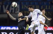 Inter Milan's forward Mauro Icardi (L) vies for the ball with Fiorentina's Italian defender Manuel Pasqual during the Italian Serie A football match on March 1, 2015 at the San Siro Stadium stadium in Milan