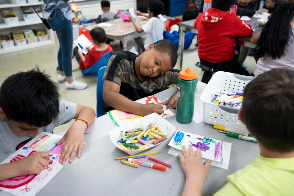 Joel King, 9, works on his letter of hope and support during his third-grade class at Columbus City's Devonshire Elementary School on the Northeast Side. King's teacher, Morgan Chase, a breast cancer survivor, was collecting the letters as a school project to give to people participating in Saturday's Susan G. Komen Race for the Cure in Columbus.
