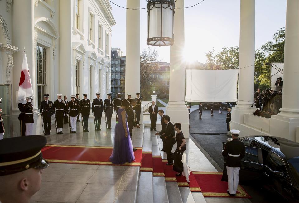 U.S. President Barack Obama and first lady Michelle Obama welcome Japanese Prime Minister Shinzo Abe and his wife Akie Abe for a State Dinner in their honor at the White House