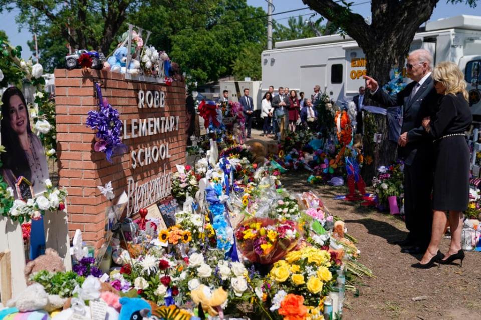 President Joe Biden and first lady Jill Biden visit Robb Elementary School to pay their respects to the victims of the mass shooting, Sunday, May 29, 2022, in Uvalde, Texas. (AP Photo/Evan Vucci)