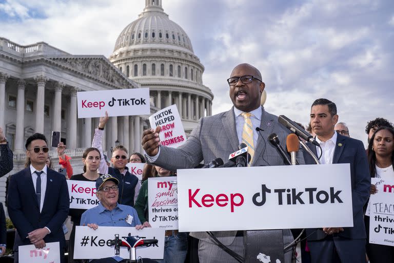 Rep. Jamaal Bowman, D-N.Y., joined at right by Rep. Robert Garcia, D-Calif., leads a rally to defend TikTok and the app's supporters, at the Capitol in Washington, Wednesday, March 22, 2023. The House holds a hearing Thursday, with TikTok CEO Shou Zi Chew about the platform's consumer privacy and data security practices and impact on kids. (AP Photo/J. Scott Applewhite)