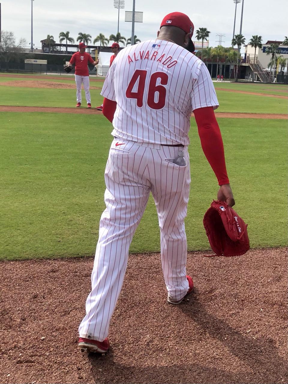 Phillies relief pitcher Jose Alvarado, wearing the new Nike-designed MLB jersey, exits a practice field following a spring-training bullpen session in Clearwater, Florida.