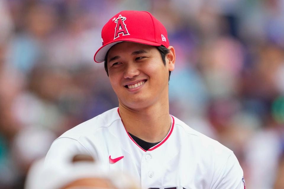 American League's Shohei Ohtani, of the Los Angeles Angels, talks near the dugout during the MLB All-Star baseball Home Run Derby in Seattle, Monday, July 10, 2023. (AP Photo/Lindsey Wasson)