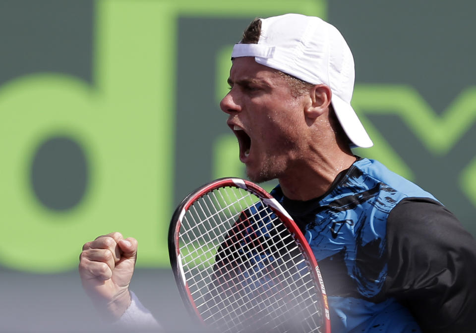 Lleyton Hewitt, of Australia, celebrates after scoring a point against Robin Haase, of the Netherlands, at the Sony Open tennis tournament in Key Biscayne, Fla., Thursday, March 20, 2014. Hewitt won 3-6, 6-3, 6-3. (AP Photo/Alan Diaz)