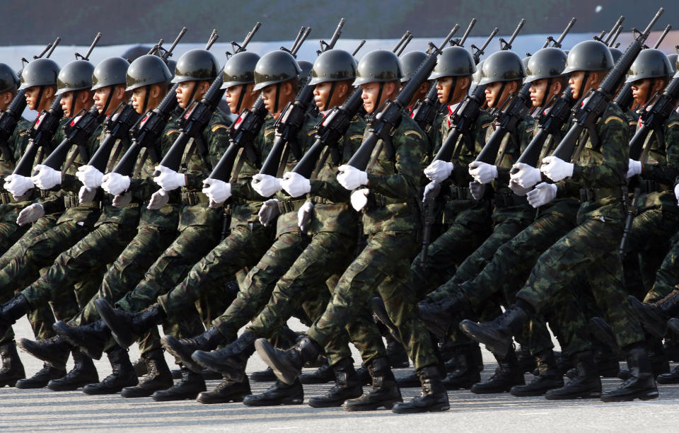 Thai soldiers parade during the Royal Thai Armed Forces Day ceremony at a military base in Bangkok, Thailand, Friday, Jan. 18, 2019. (AP Photo/Sakchai Lalit)