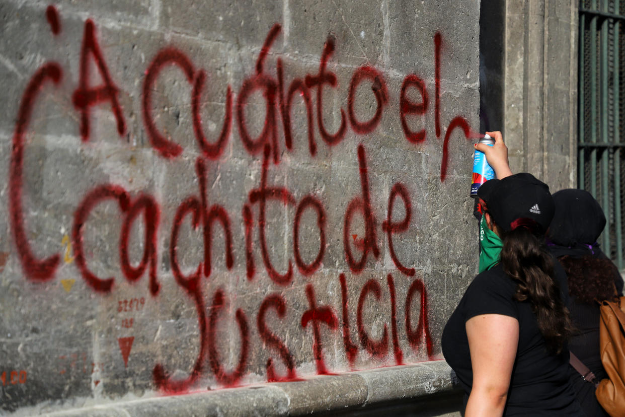 MEXICO CITY, MEXICO - JULY 20: A demonstrator writes in Spanish 