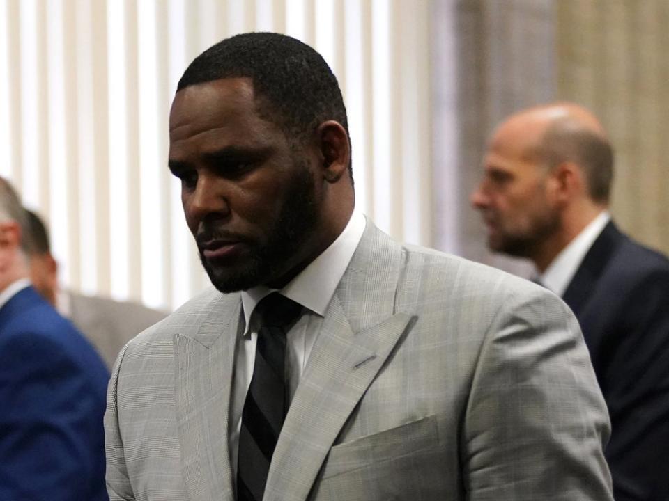 R Kelly pleads not guilty to a new indictment before Judge Lawrence Flood at Leighton Criminal Court Building in Chicago, Illinois, on 6 June 2019 (E JASON WAMBSGANS/AFP via Getty Images)