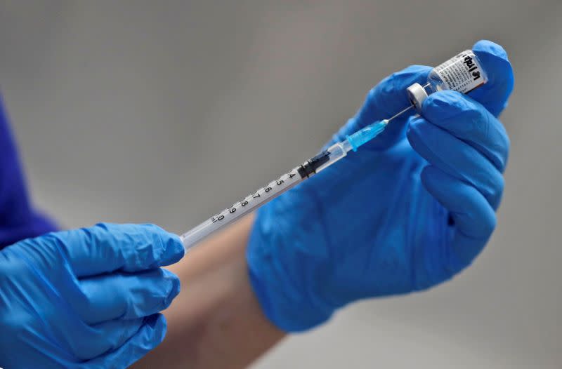 FILE PHOTO: A nurse prepares to administer the Pfizer-BioNTech COVID-19 vaccine at Guy's Hospital in London