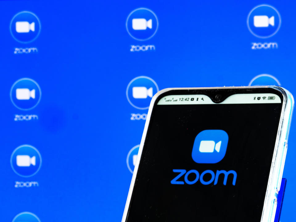 UKRAINE - 2021/02/01: In this photo illustration a Zoom Video Communications, Inc. logo is seen displayed on a smartphone screen. (Photo Illustration by Igor Golovniov/SOPA Images/LightRocket via Getty Images)